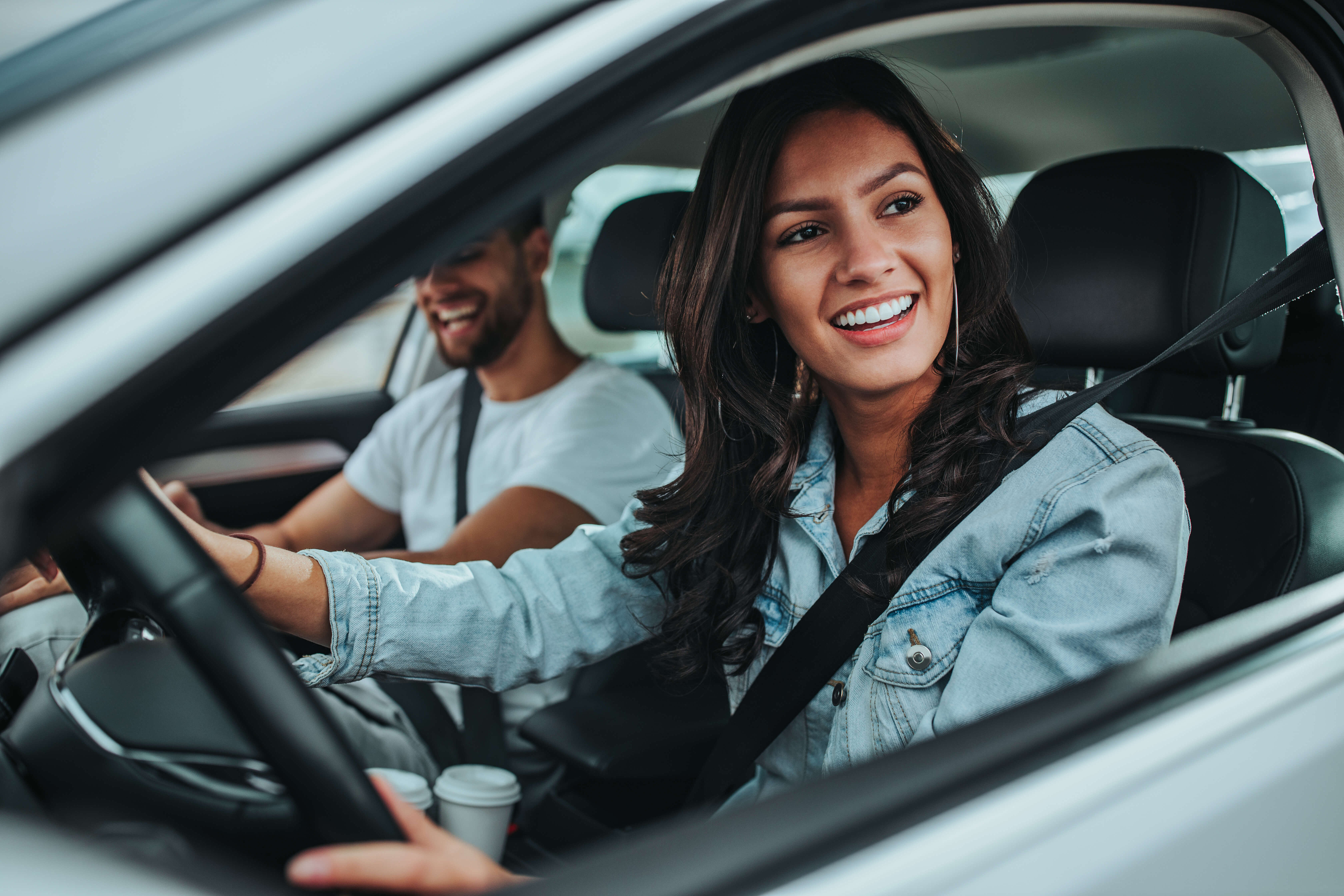 Young woman driving car