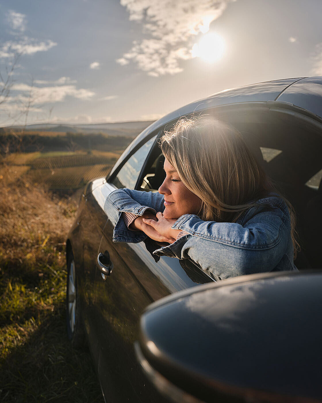 Woman enjoying car